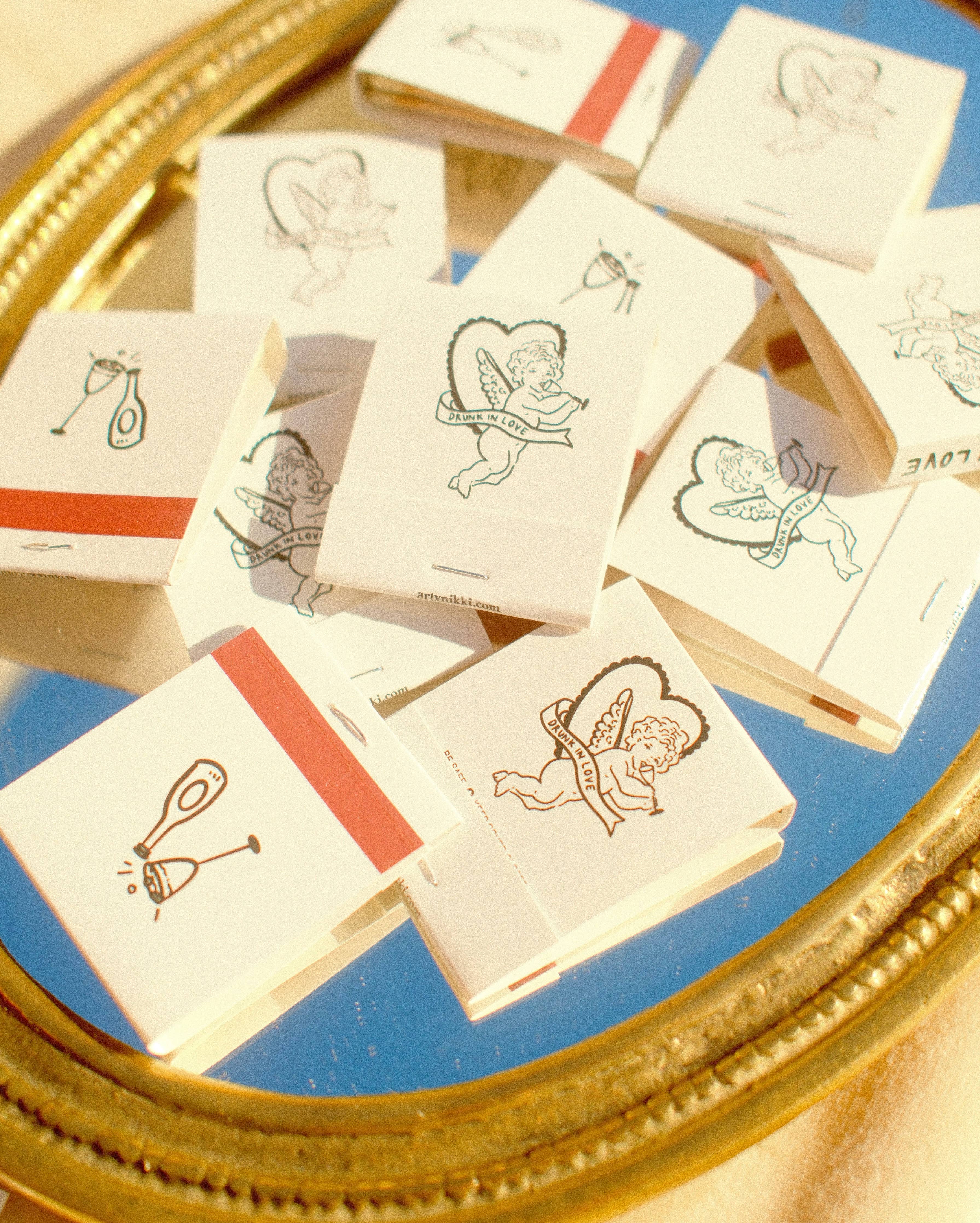 “Drunk In Love” Cupid Champagne Matchbook